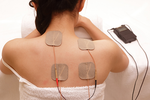 How electric muscle stimulation (EMS) is used for rehabilitation of low back  pain